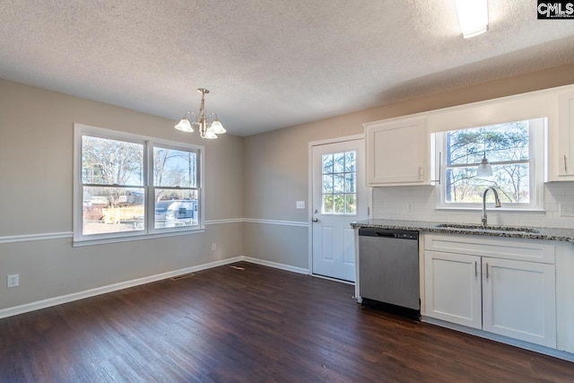 kitchen with light stone countertops, dishwasher, sink, pendant lighting, and white cabinets