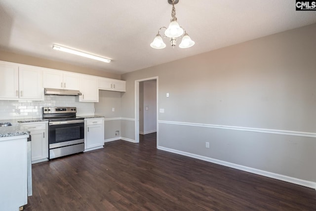 kitchen featuring stainless steel electric range oven, backsplash, a chandelier, pendant lighting, and white cabinets