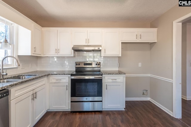 kitchen with sink, white cabinets, and appliances with stainless steel finishes