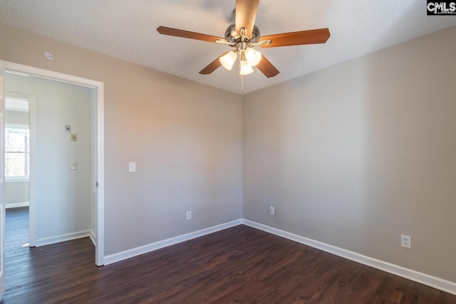 unfurnished room featuring a textured ceiling, dark hardwood / wood-style floors, and ceiling fan