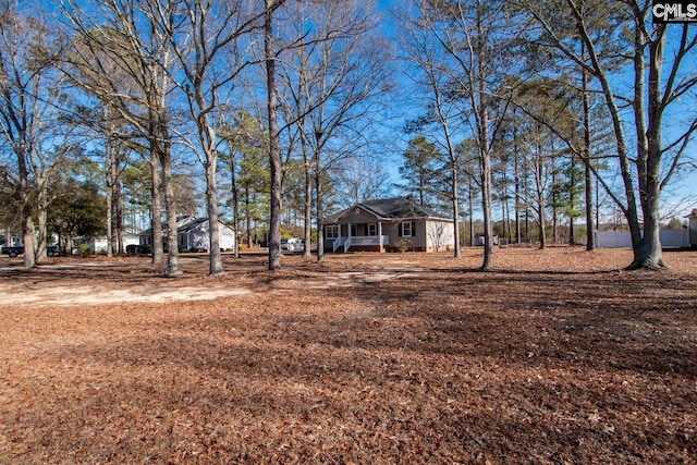 view of yard with covered porch