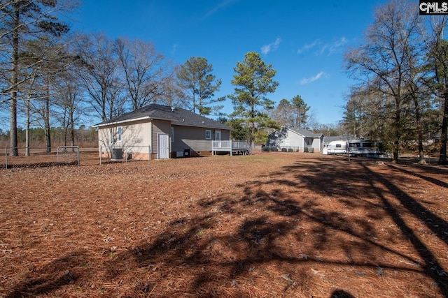 view of property exterior with a deck