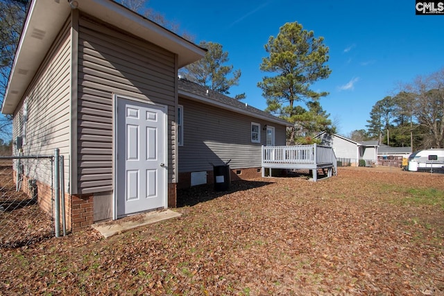 view of side of home featuring a deck