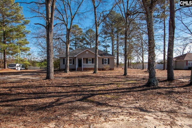 single story home with a porch