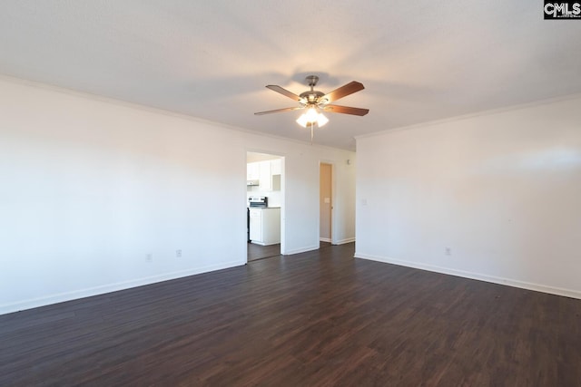 spare room with crown molding, ceiling fan, and dark wood-type flooring