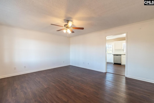 spare room featuring ornamental molding, a textured ceiling, ceiling fan, and dark wood-type flooring