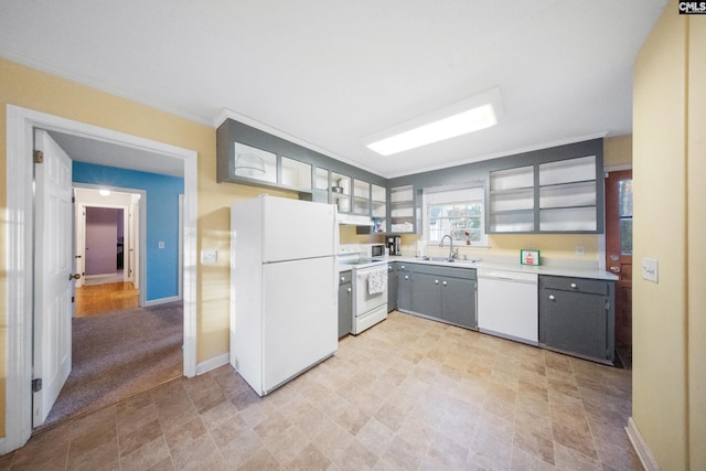 kitchen with light carpet, white appliances, and sink