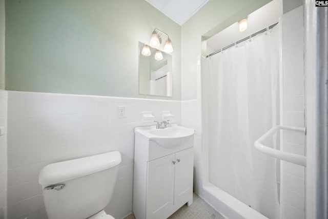 bathroom with a shower with curtain, vanity, tile walls, and toilet