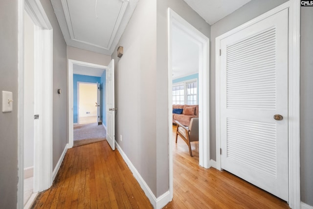 hall with light hardwood / wood-style flooring