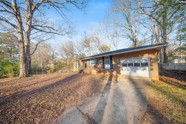 single story home featuring a garage