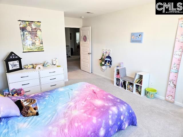 bedroom with visible vents, baseboards, and carpet floors