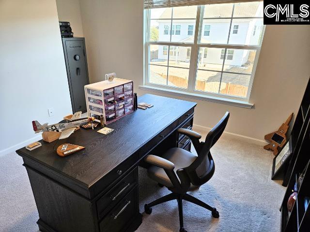 office space featuring baseboards and carpet floors