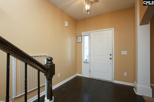 foyer with dark hardwood / wood-style floors