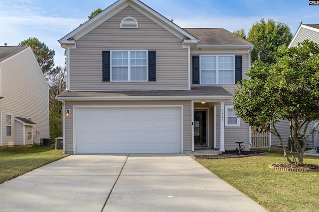 view of front property featuring a garage, a front lawn, and central air condition unit