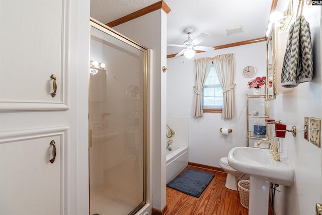 bathroom with separate shower and tub, crown molding, hardwood / wood-style floors, and ceiling fan