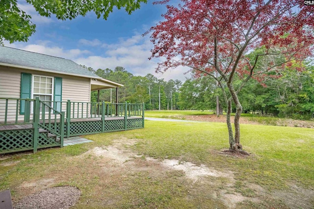 view of yard featuring a wooden deck