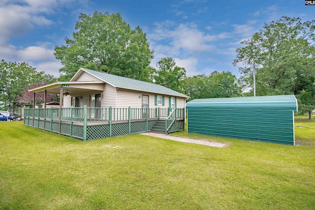 back of house featuring a yard and a wooden deck