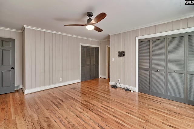 unfurnished bedroom with light hardwood / wood-style floors, ceiling fan, and ornamental molding