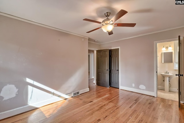 unfurnished bedroom featuring connected bathroom, ceiling fan, sink, light hardwood / wood-style flooring, and ornamental molding