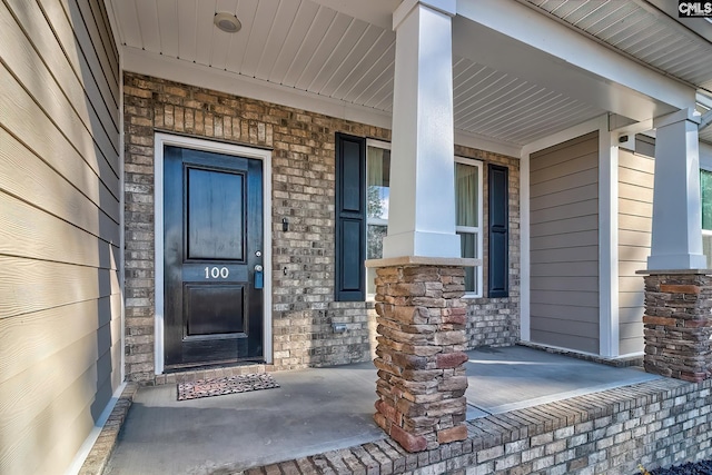 doorway to property with a porch