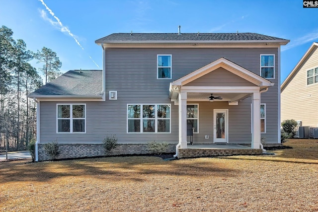 back of property featuring ceiling fan, a patio, central AC unit, and a lawn