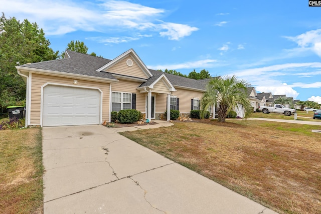 ranch-style home featuring a front yard and a garage