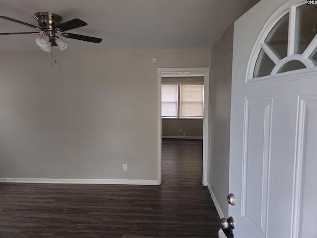 spare room featuring ceiling fan and dark hardwood / wood-style flooring