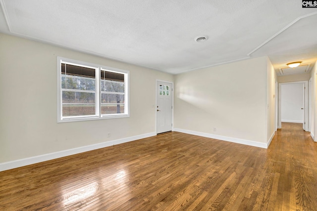 interior space with hardwood / wood-style floors and a textured ceiling