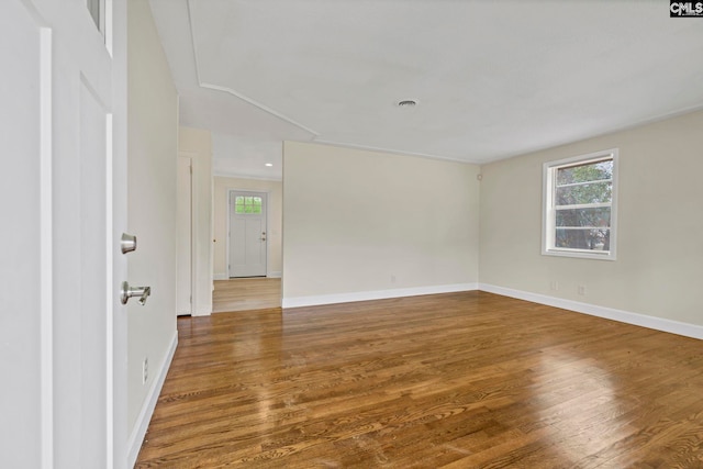 spare room with hardwood / wood-style flooring