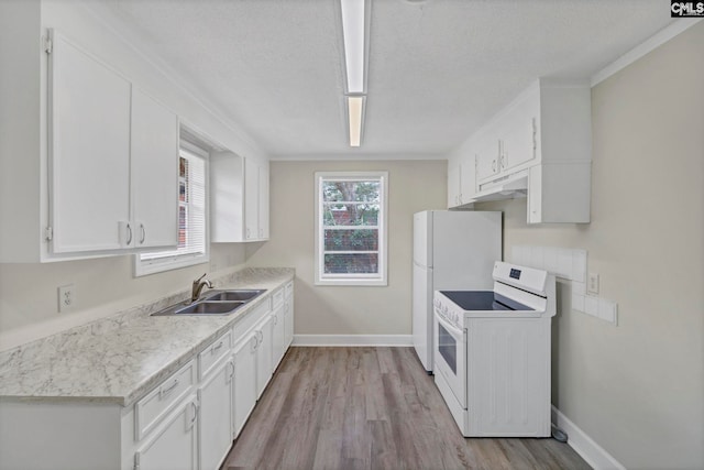 kitchen with a textured ceiling, white appliances, sink, white cabinets, and light hardwood / wood-style floors