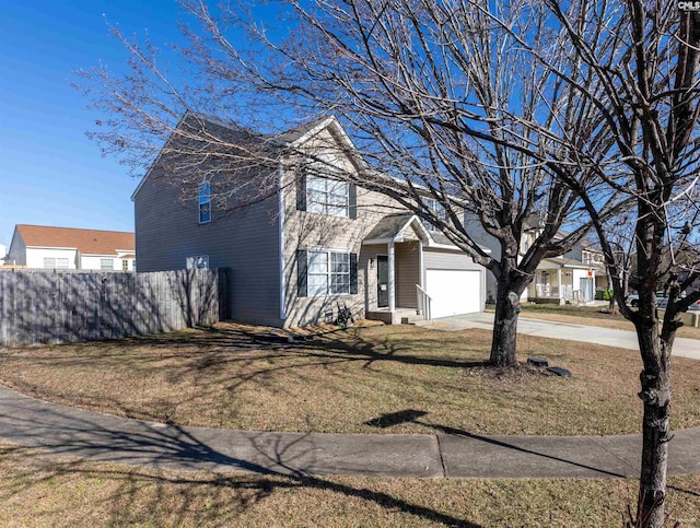 view of front of house featuring a garage and a front yard