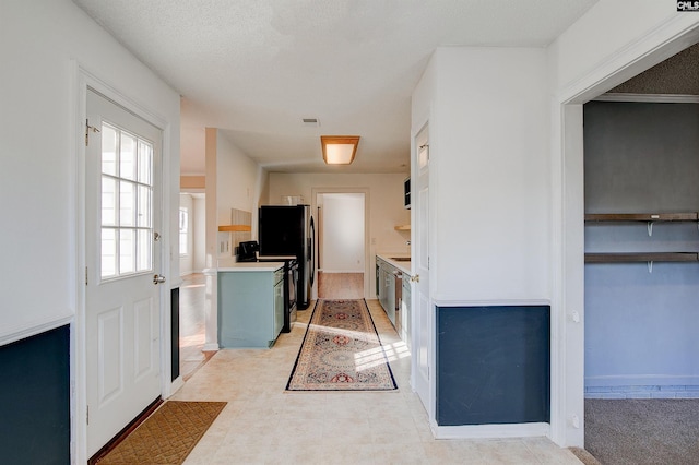 kitchen with stainless steel refrigerator