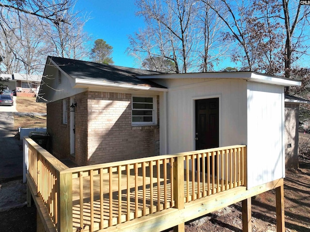 view of side of property featuring a deck