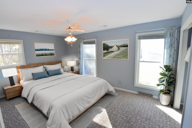 carpeted bedroom featuring ceiling fan