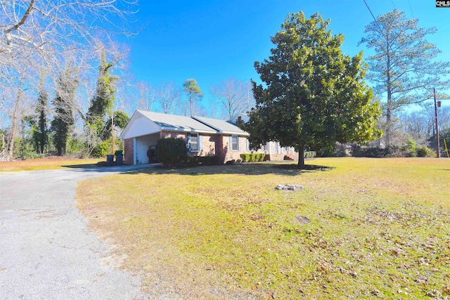 view of side of home featuring a lawn