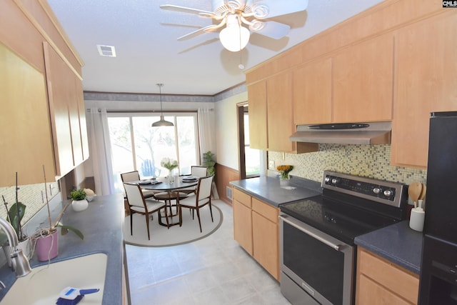 kitchen with light brown cabinets, electric range, and sink