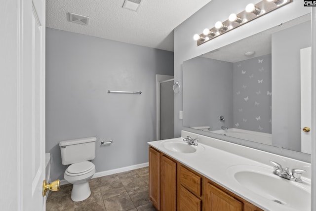 full bathroom with vanity, separate shower and tub, toilet, and a textured ceiling