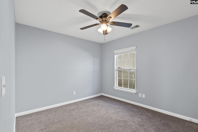 spare room with carpet, a textured ceiling, and ceiling fan