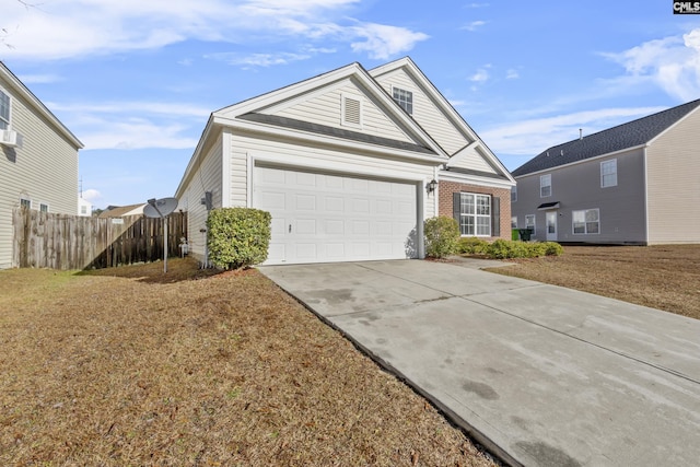 view of front facade with a front yard and a garage