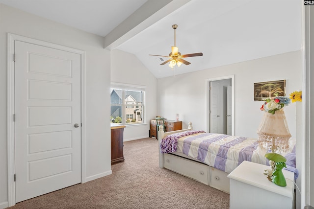 bedroom featuring carpet flooring, vaulted ceiling, and ceiling fan