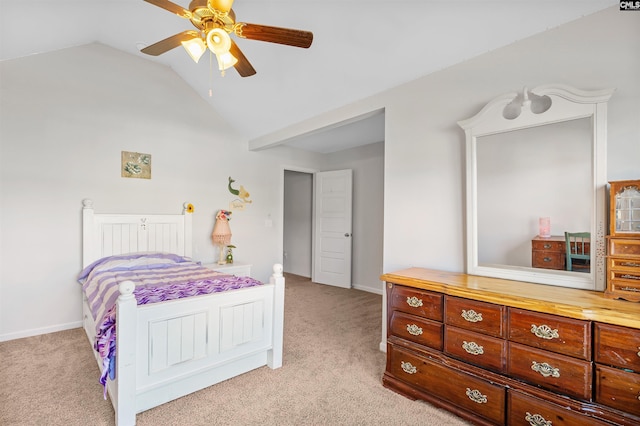 carpeted bedroom featuring ceiling fan and vaulted ceiling