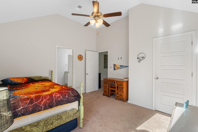 bedroom with carpet flooring, connected bathroom, vaulted ceiling, and ceiling fan