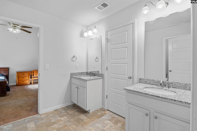 bathroom with ceiling fan and vanity