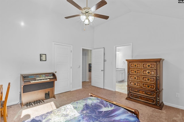 carpeted bedroom featuring connected bathroom, ceiling fan, and lofted ceiling