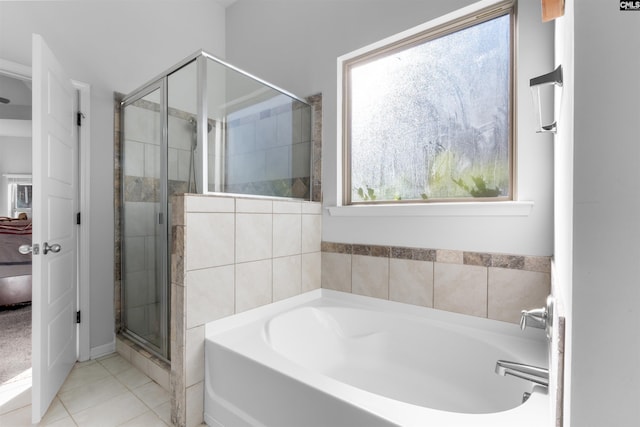 bathroom with tile patterned flooring and plus walk in shower