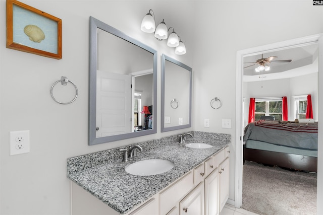 bathroom with tile patterned floors, ceiling fan, and vanity