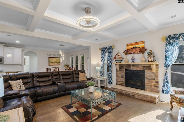 living room featuring beam ceiling, wood-type flooring, and coffered ceiling