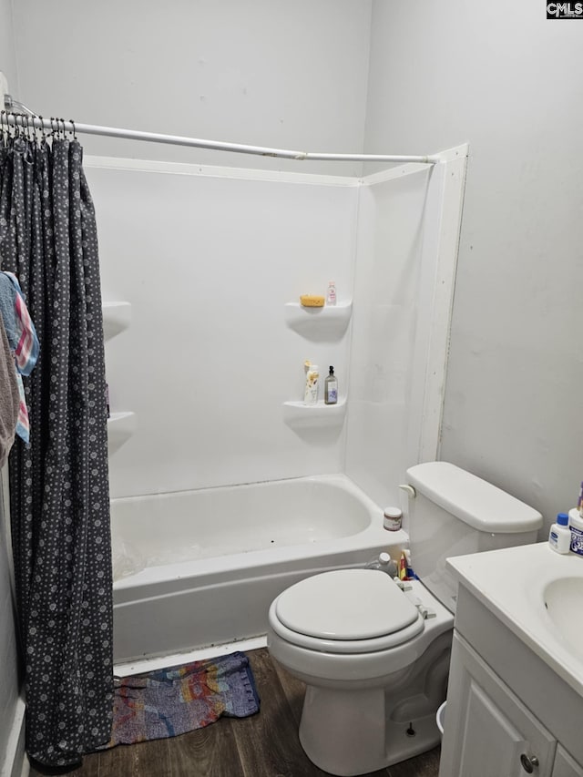 full bathroom featuring hardwood / wood-style flooring, vanity, toilet, and shower / bath combo