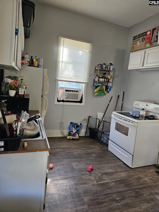 kitchen featuring electric range, dark hardwood / wood-style flooring, cooling unit, a textured ceiling, and white cabinets