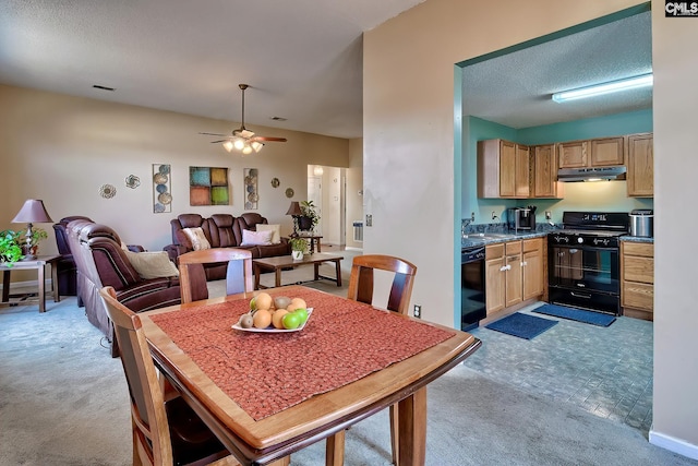 dining area with light carpet, a textured ceiling, ceiling fan, and sink